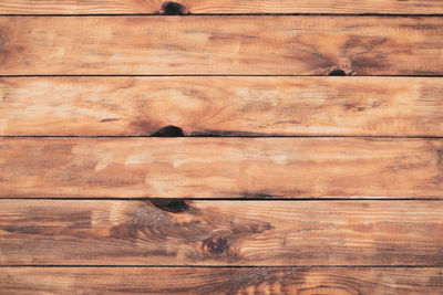 Dark brown wood texture with natural striped pattern for background, wooden surface