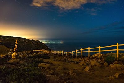 Scenic view of sea against sky at night