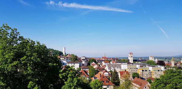 View of townscape against blue sky