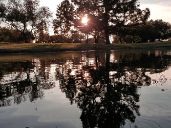 Scenic view of lake against sky during sunset