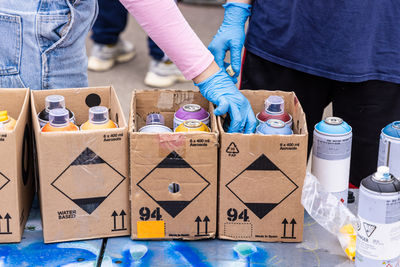 Low section of woman holding gift