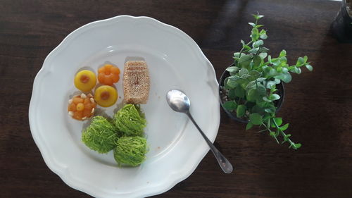 High angle view of vegetables in plate on table