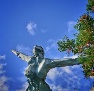 Low angle view of statue against sky