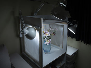 Close-up of flower vase on table at home