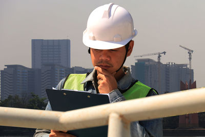 Man using mobile phone in city