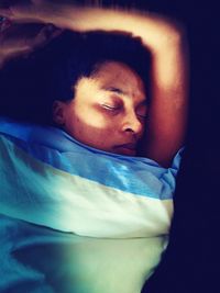 Portrait of boy sleeping in bed