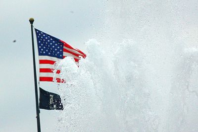 Low angle view of flag against sky