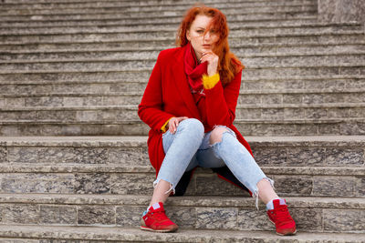 Portrait of woman sitting on steps