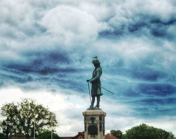 Low angle view of statue against sky