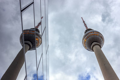 Low angle view of communications tower against sky