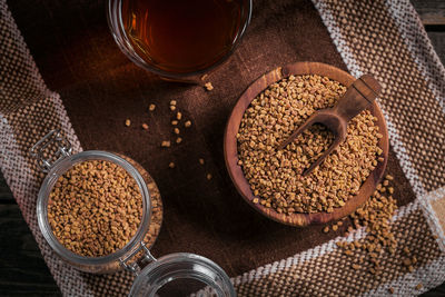 Bowl of fenugreek seeds and egyptian fenugreek yellow tea or methi dana drink