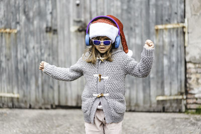 Woman wearing sunglasses standing outdoors