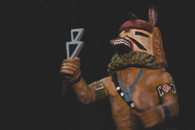 Close-up of stuffed toy against black background