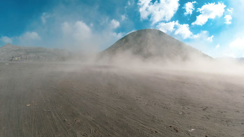 Scenic view of volcanic landscape against sky