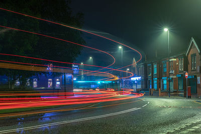 High angle view of light trails on road at night