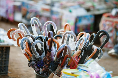 Close-up of various umbrellas for sale at market stall