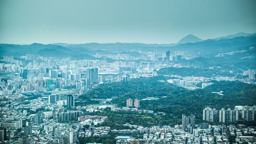 Aerial view of cityscape against clear sky