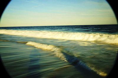 Scenic view of sea against sky at sunset