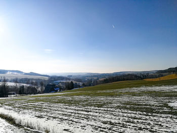Scenic view of field against clear sky