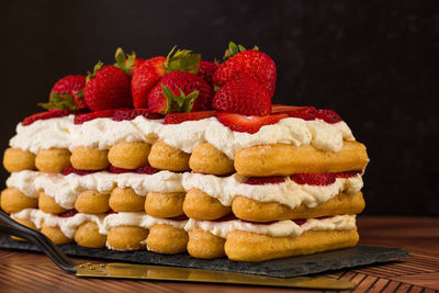 Close-up of fruits on cake