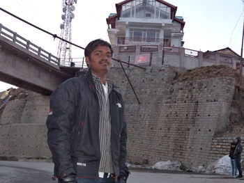 Full length of man with cityscape in background