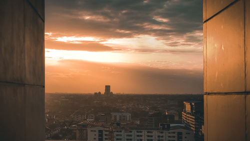 High angle view of buildings against sky during sunset