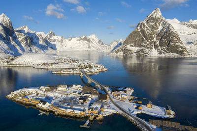 Panoramic view of lake and snowcapped mountains against sky