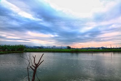 Scenic view of lake against sky during sunset