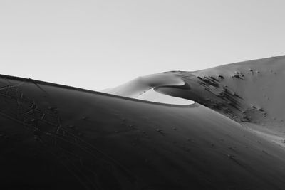 View of sand dune against clear sky