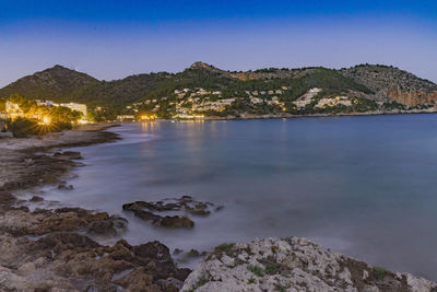 Scenic view of sea against clear blue sky