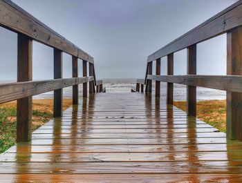 Pier over sea against sky