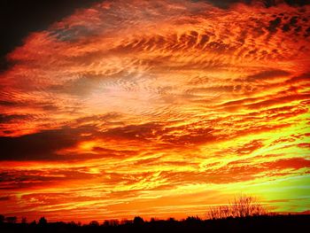 Scenic view of landscape against sky at sunset