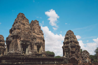 Low angle view of old temple building against sky