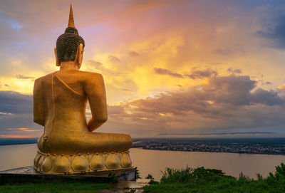 Statue against sky during sunset