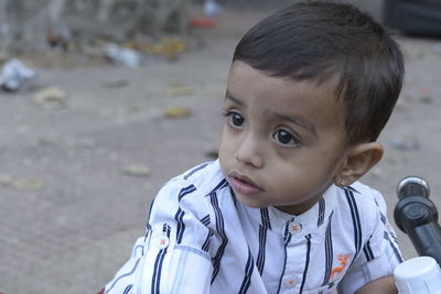 Portrait of cute boy looking away