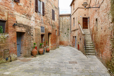 Alley amidst buildings in city