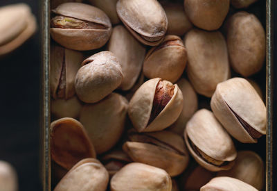 High angle view of pistachios in container