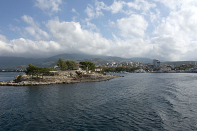 Scenic view of sea and buildings against sky