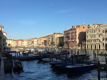 Boats moored in city