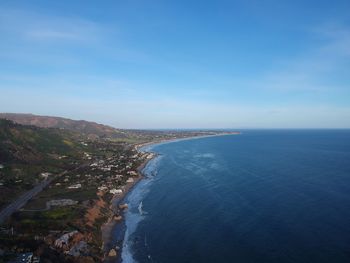 Scenic view of sea against blue sky