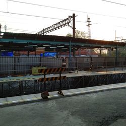 Train at railroad station against sky