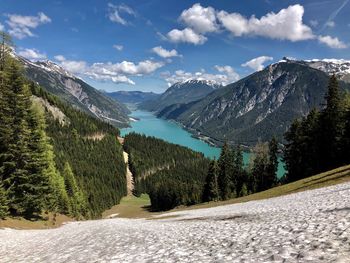 Panoramic view of road by mountains against sky