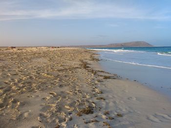 Scenic view of beach against sky