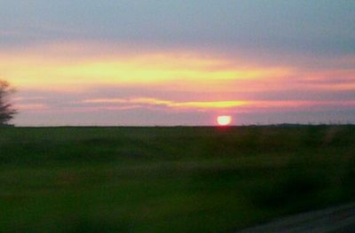 Scenic view of landscape against sky during sunset