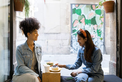 Women sitting on table