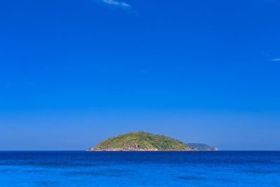 Scenic view of sea against clear blue sky