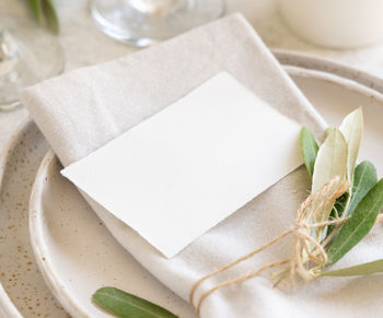 High angle view of bread on white table