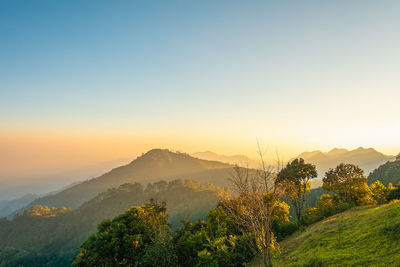 Scenic view of mountains against sky during sunset