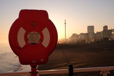 View of city against sky during sunset