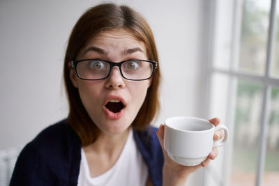 Portrait of woman drinking coffee